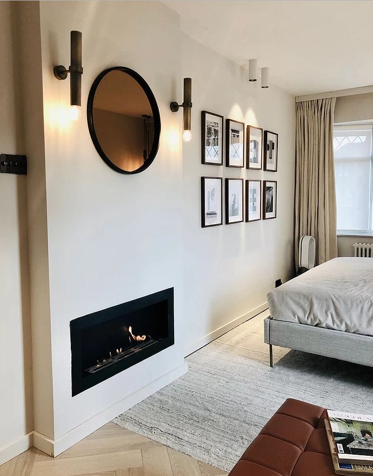 Bedroom wall with fire embedded and mirror above
